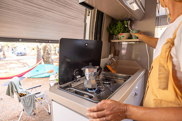 istock Woman Making Coffee in Cozy Van Kitchen 2225865539