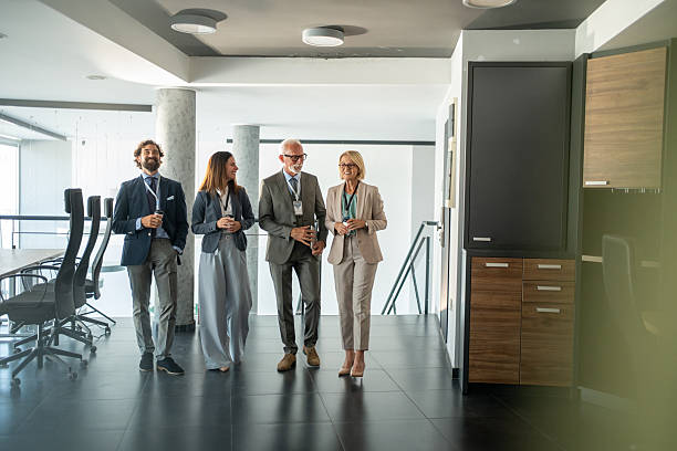 istock Business people walking and talking in modern office 2225866680