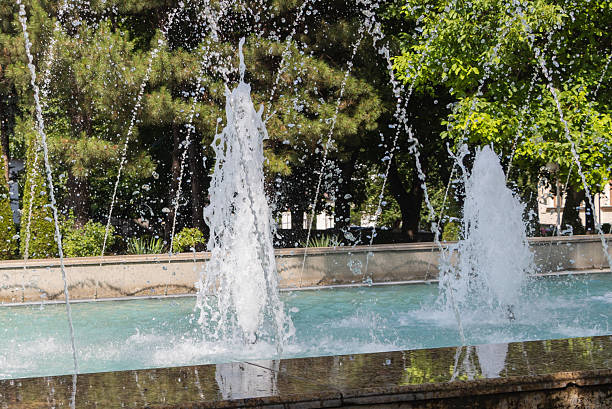istock Spirited Water Jets Dancing in Sunlit Park Fountain 2225871210