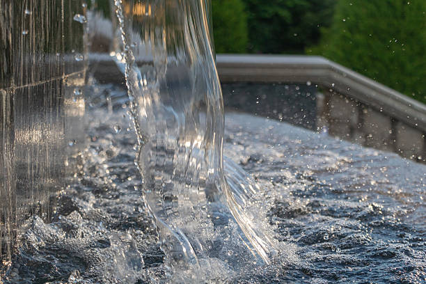 istock Crystal Cascade Over Polished Fountain Edge in Golden Light 2225871211