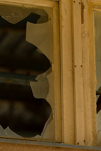 istock This image shows a close up of a broken window featuring a wooden frame 2225871455
