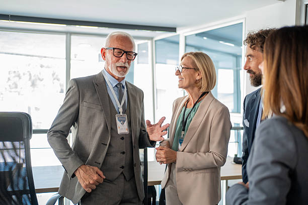 istock Business people talking during conference break 2225874844