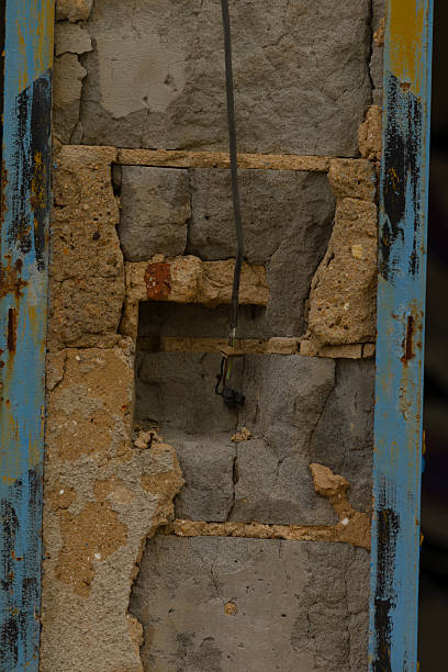 istock This image shows a close up view of a brick wall that has a hole in it 2225875644