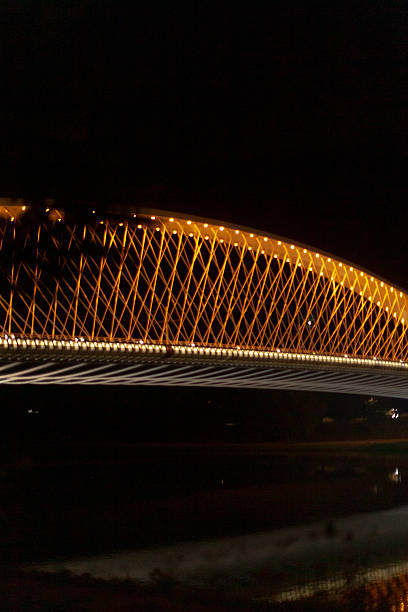 istock A welllit bridge decorated with lights at night, creating beauty 2225880161