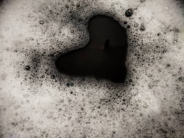 istock Foam background. Liquid soap bubbles. Frame made of Froth bubbles, on black backdrop. 2225882088