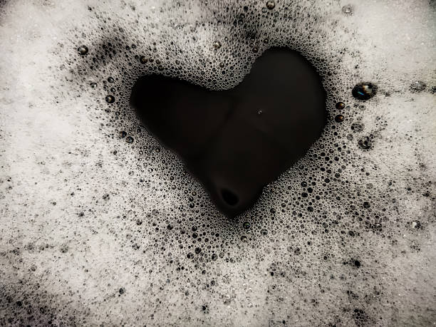 istock Foam background. Liquid soap bubbles. Frame made of Froth bubbles, on black backdrop. 2225882154