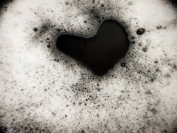istock Foam background. Liquid soap bubbles. Frame made of Froth bubbles, on black backdrop. 2225882185
