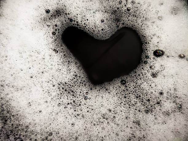 istock Foam background. Liquid soap bubbles. Frame made of Froth bubbles, on black backdrop. 2225882202