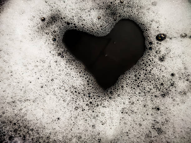 istock Foam background. Liquid soap bubbles. Frame made of Froth bubbles, on black backdrop. 2225882214