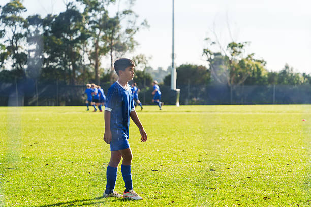 istock Game-ready soccer player on field. 2225884815