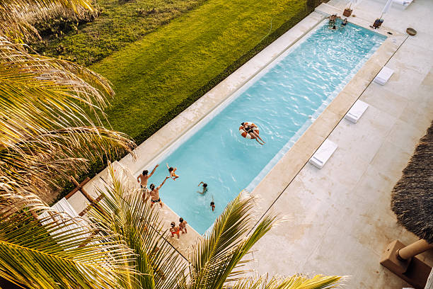 Family spending a summer day at the pool