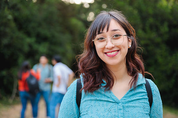 istock Latina student with glasses smiling in natural setting 2225888149