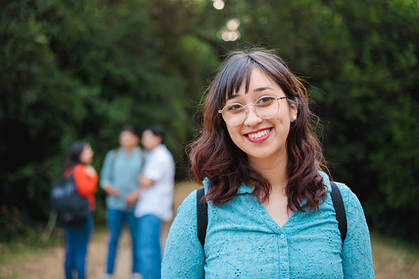 istock Latina student smiling with confidence during outdoor campus walk 2225888150