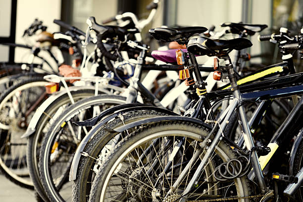 istock Row of bicycles parked outdoors with focus on foreground wheels 2225889993