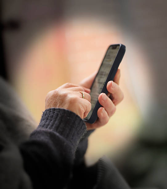 Close-up of hands using a smartphone, blending modern technology with the serene ambiance