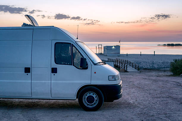 istock Camper van parked on a beach at sunset in Sardinia, Italy 2225904137