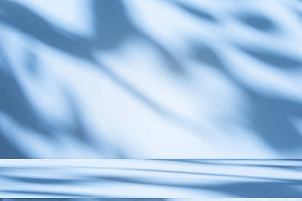 istock Studio style background wall decoration presentation uses white and blue tones. with shadows cast from a nearby window, concept creating a decorative 2225904152