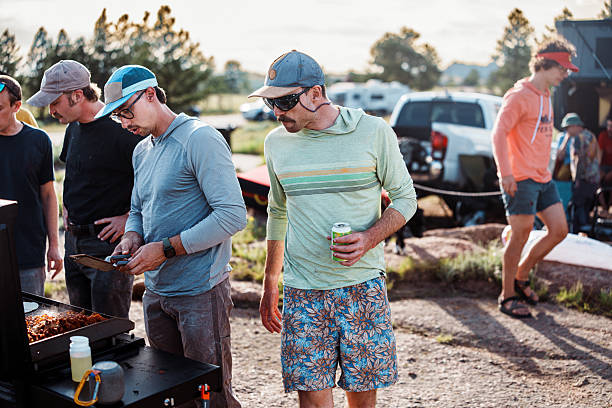 istock Friends making dinner at campsite 2225910432