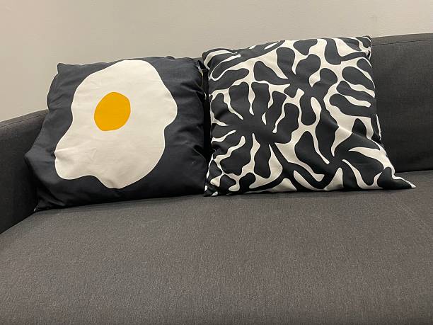 Black Modern Sofa with Graphic Egg and Abstract Monochrome Throw Pillows – Minimalist Home Decor