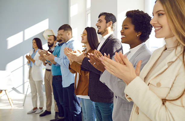 istock Joyful and satisfied audiences applaud speaker during business conference or seminar. 2225912030