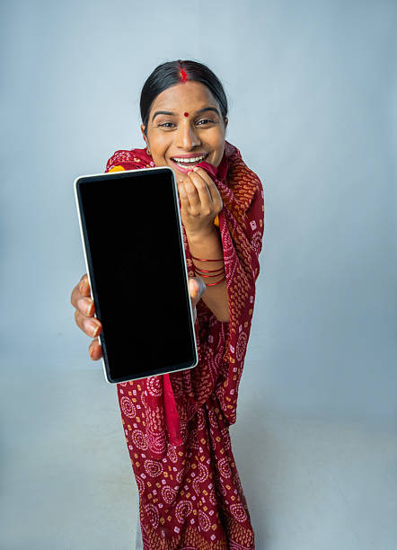 istock Happy woman showing smart phone on white background 2225914977
