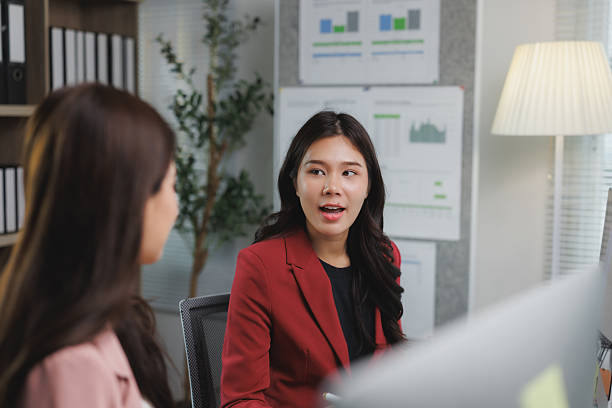 istock Asian businesswomen discussing work in office 2225918882
