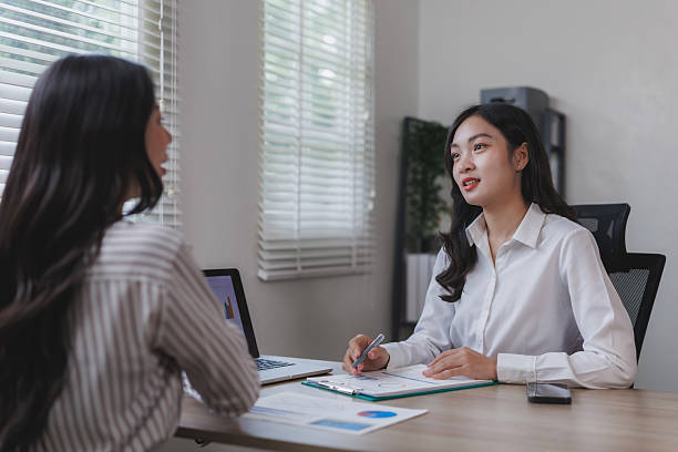 istock Two businesswomen discussing charts and graphs in modern office 2225923005