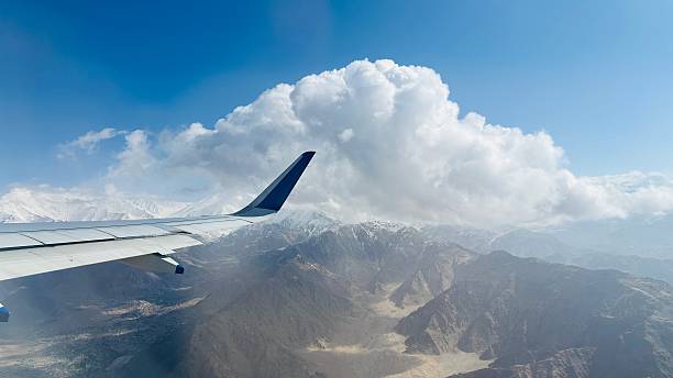 istock Airplane Wing Flying Over Himalayan Mountains 2225923591