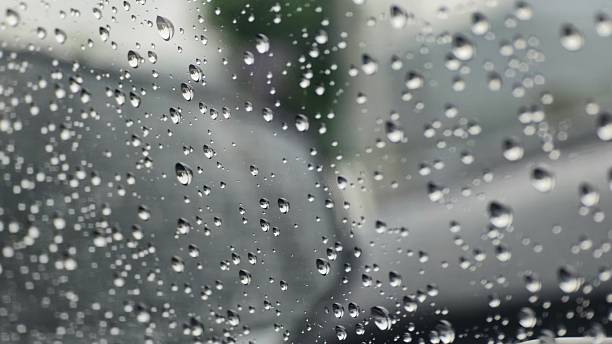 istock Raindrops on Glass Window in Overcast Weather 2225924357