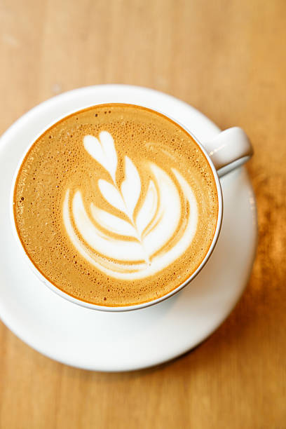 istock Cup of hot milk latte coffee on table by the window. 2225924600