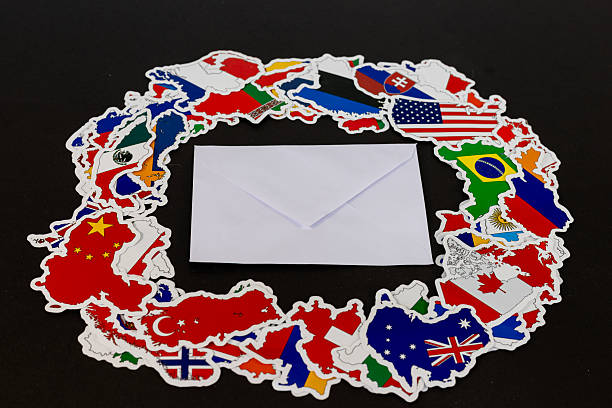 istock Sealed White Envelope Centered in International Country Flags Circle 2225927707