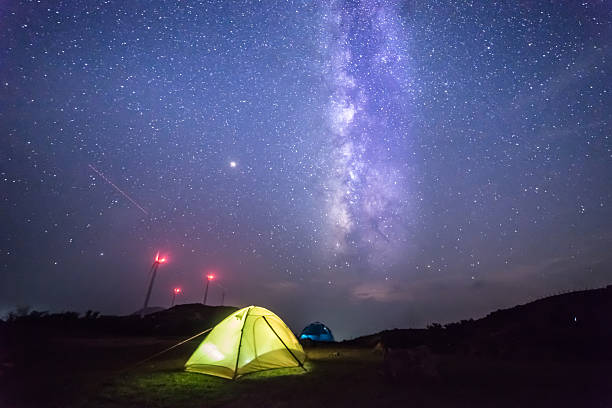 istock Camping outdoors under the beautiful starry sky 2225930923