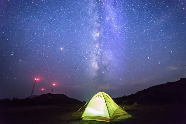 istock Camping outdoors under the beautiful starry sky 2225930927