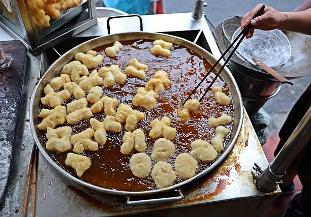 istock Cooking Deep fried Dough Sticks - food preparation. 2225932462
