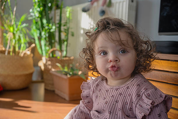 istock Adorable Toddler Pouting in a Sunlit Room 2225933957