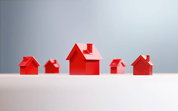 istock Red House Objects Before Defocused Background - Real Estate And House Rental Concept 2225936796