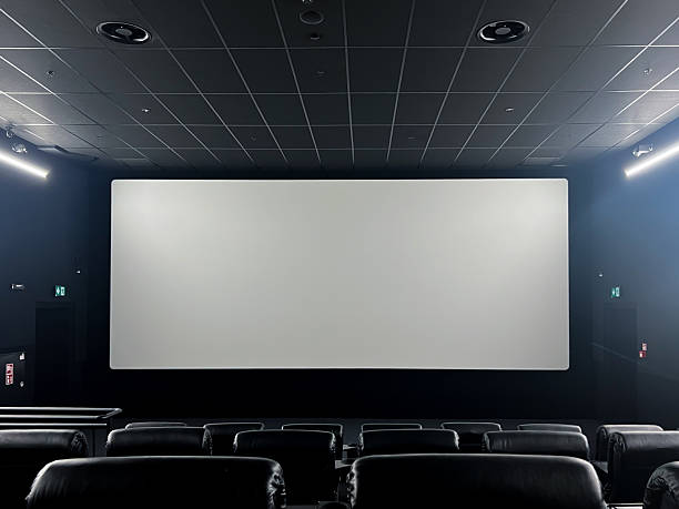 istock Spacious modern cinema hall featuring comfortable black leather seats and a large blank screen, ready for an immersive film viewing or presentation 2225941371