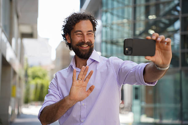 istock Confident businessman using smartphone outdoors in urban cityscape 2225942701