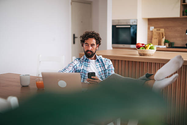 istock Freelancer working from home using laptop and smartphone 2225945924