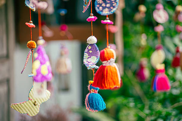 istock Colorful traditional Turkish crafts, including evil eye amulets and ceramic ornaments, displayed at a local artisan shop. 2225946488