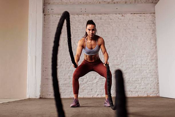 istock Determined Fit Woman Training with Battle Ropes 2225947710