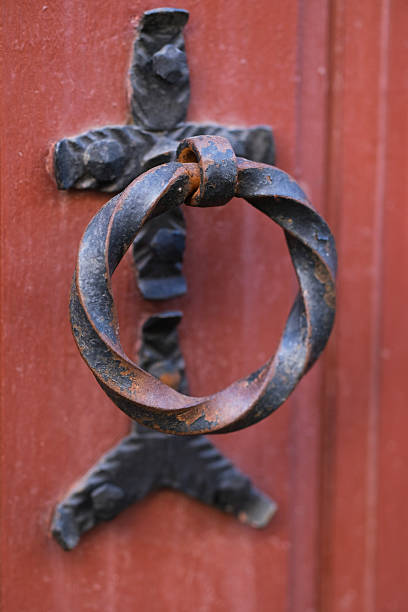 Old iron door knocker wing