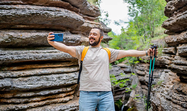 istock Young male hiker taking a selfie in a canyon while hiking 2225949514