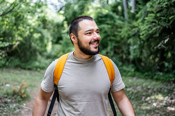 istock Young male hiker exploring forest trail with backpack 2225949720