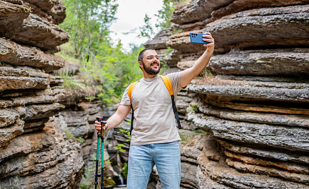 istock Young male hiker taking a selfie in a canyon 2225950036