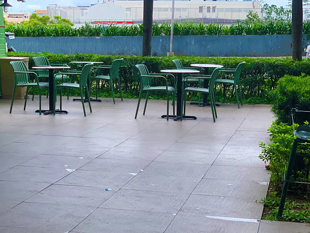 istock green chairs and tables with plants outside 2225950405