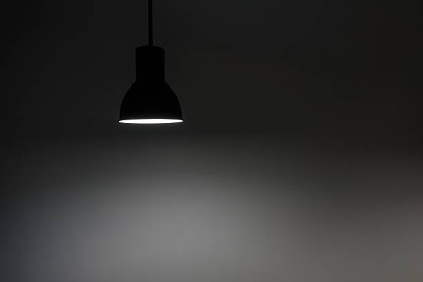 istock a shining hanged ceiling lamp without electric wire  with dark blue tone dirty concrete background wall 2225952381