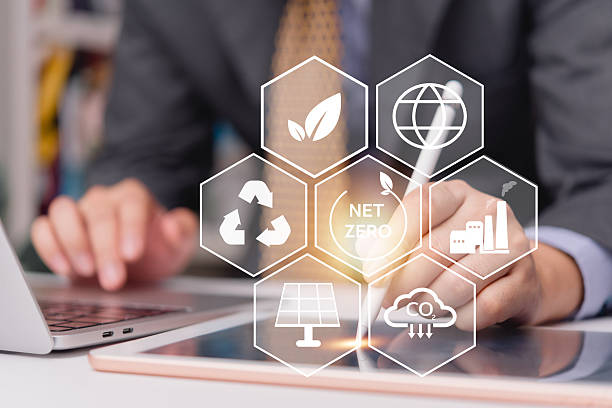 istock Businessman using tablet to plan ESG and net zero strategy with clean energy and carbon reduction icons for sustainable development goals.CO2 emission reduction, green energy, and environmental 2225953139