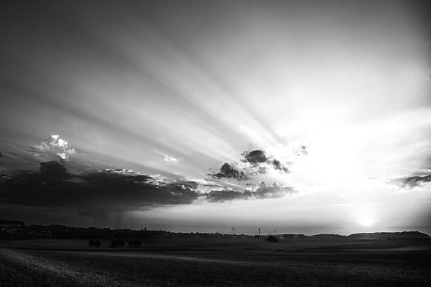 istock Wind Turbines beneath Dramatic Clouds in Monochrome Agricultural Landscape 2225954511