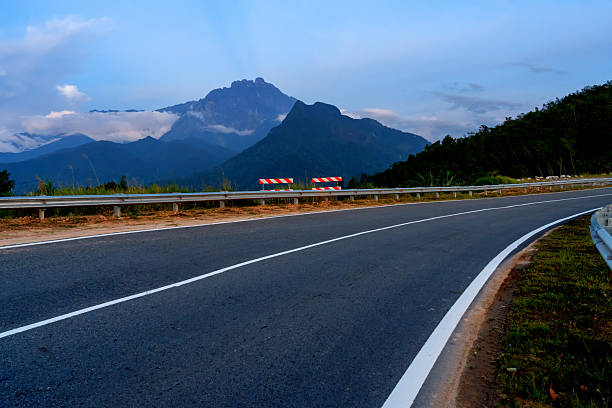 istock Mt. Kinabalu and asphalt road 2225955204
